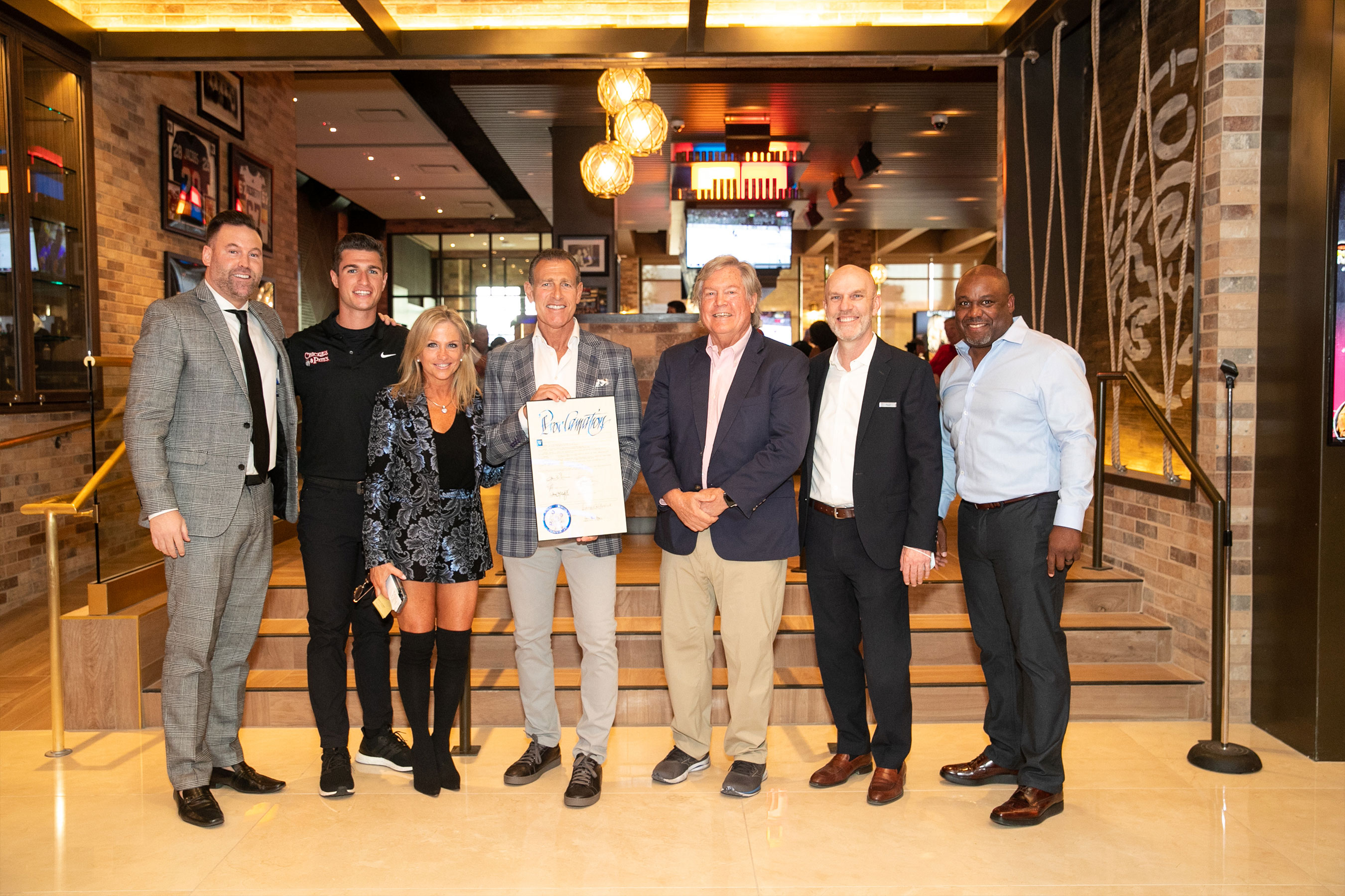 (L-R) Anthony Olheiser, Peter Ciarrocchi, Lisa Ciarrocchi, Pete Ciarrocchi, Clark County Commisioner Tick Segerblom, Paul Hobson and former Philadelphia Eagles player Mark McMillian at the grand opening of Chickie’s & Pete’s Crab House and Sports Bar inside SAHARA Las Vegas