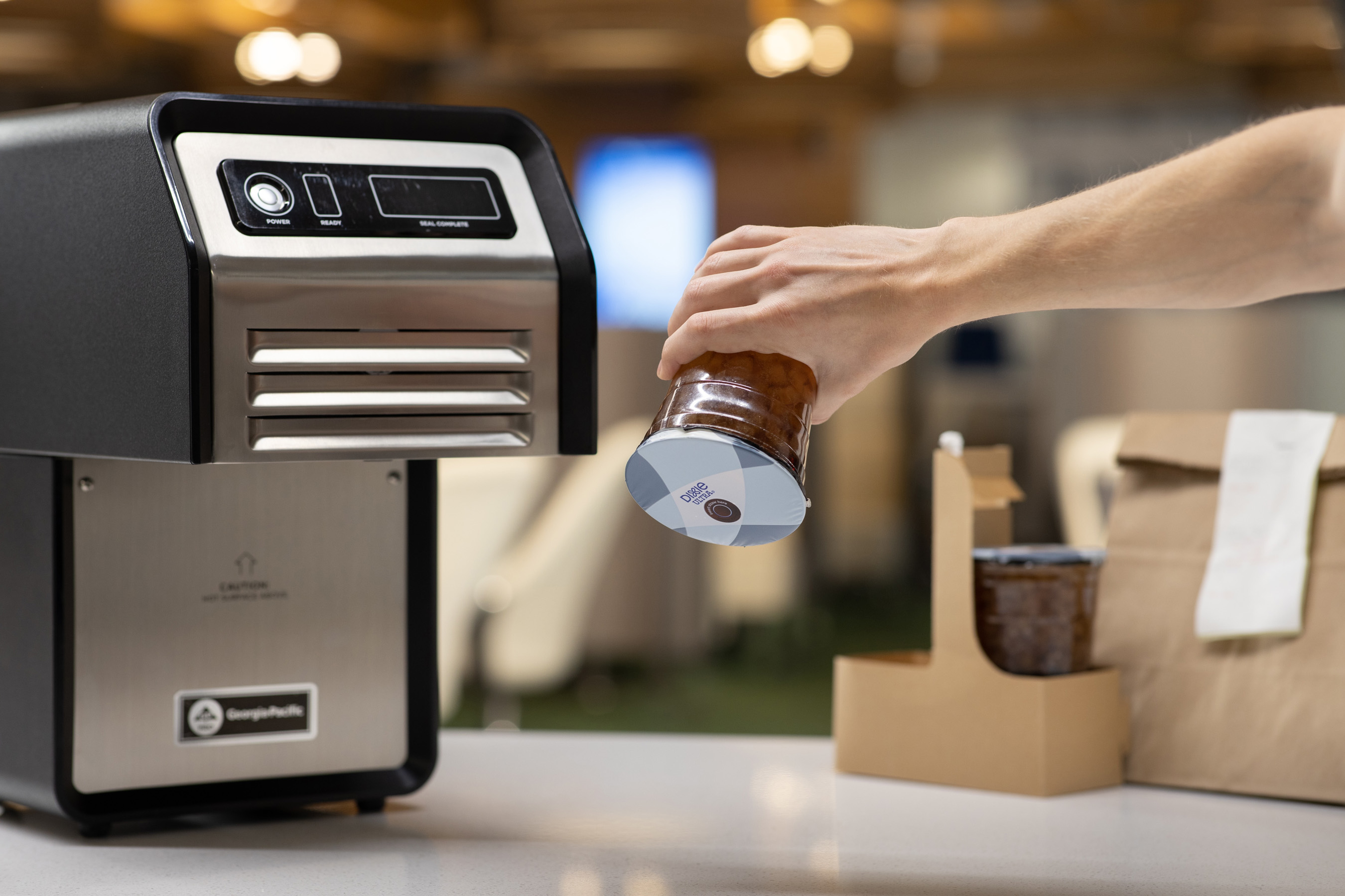 The GP PRO Automated Sealing Machine automatically applies a heat-activated film seal to beverage cups so customers can enjoy tamper-evident, spill-resistant drinks on-the-go.