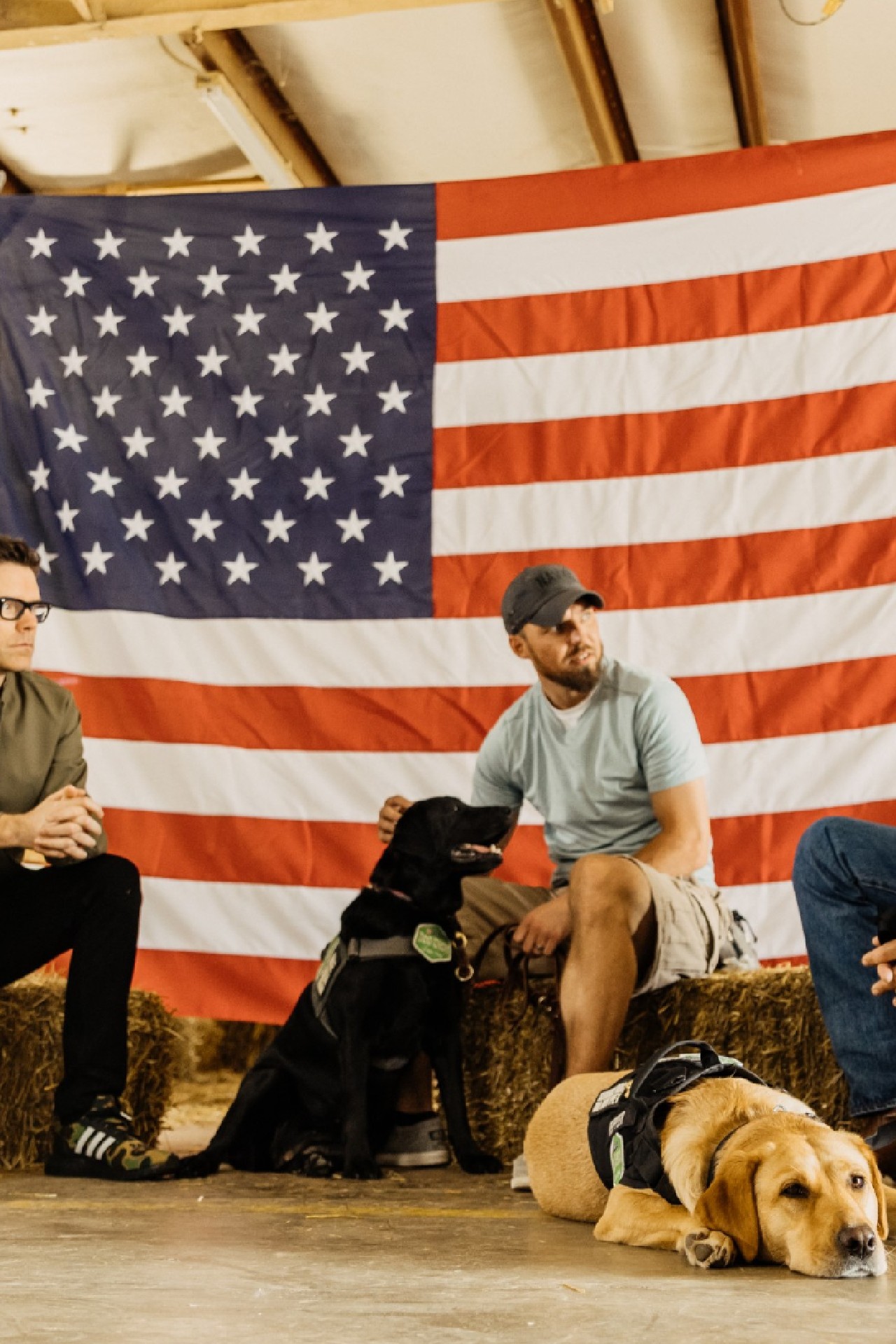 Dog Chow partner and TV/radio personality Bobby Bones with veterans Andy and Shannon for the fourth annual Dog Chow Service Dog Salute campaign
