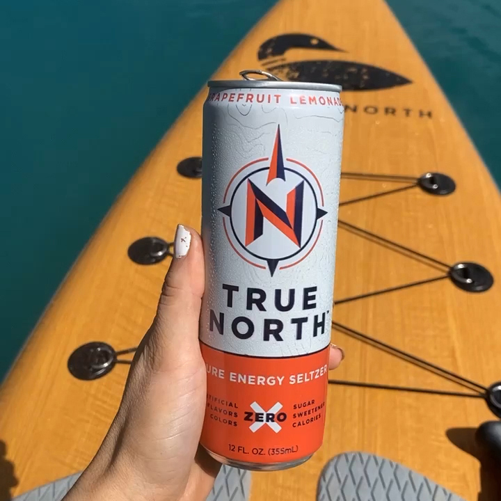 Michelle Lawrence - @michelle.lawrencee Paddleboarding with her favorite True North flavor, Grapefruit Lemonade