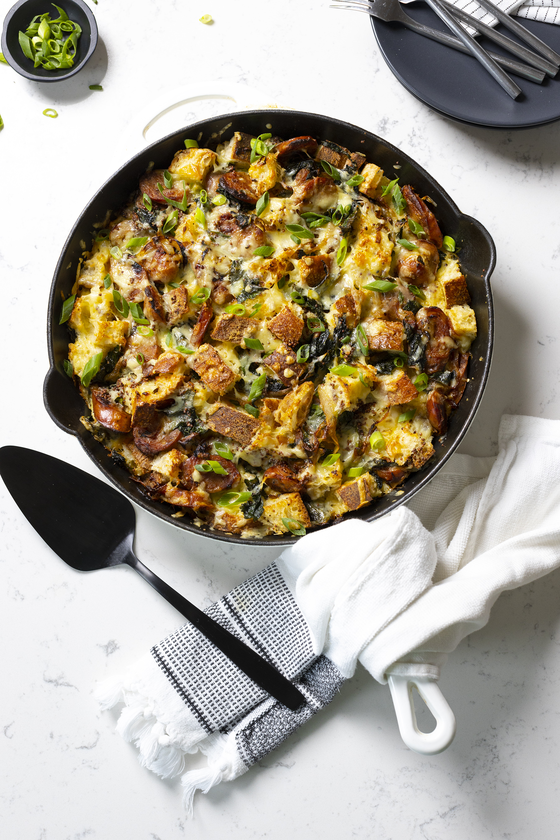 A strata that can be devoured any time of day, filled with cheddar cheese, kale and chicken apple sausage.