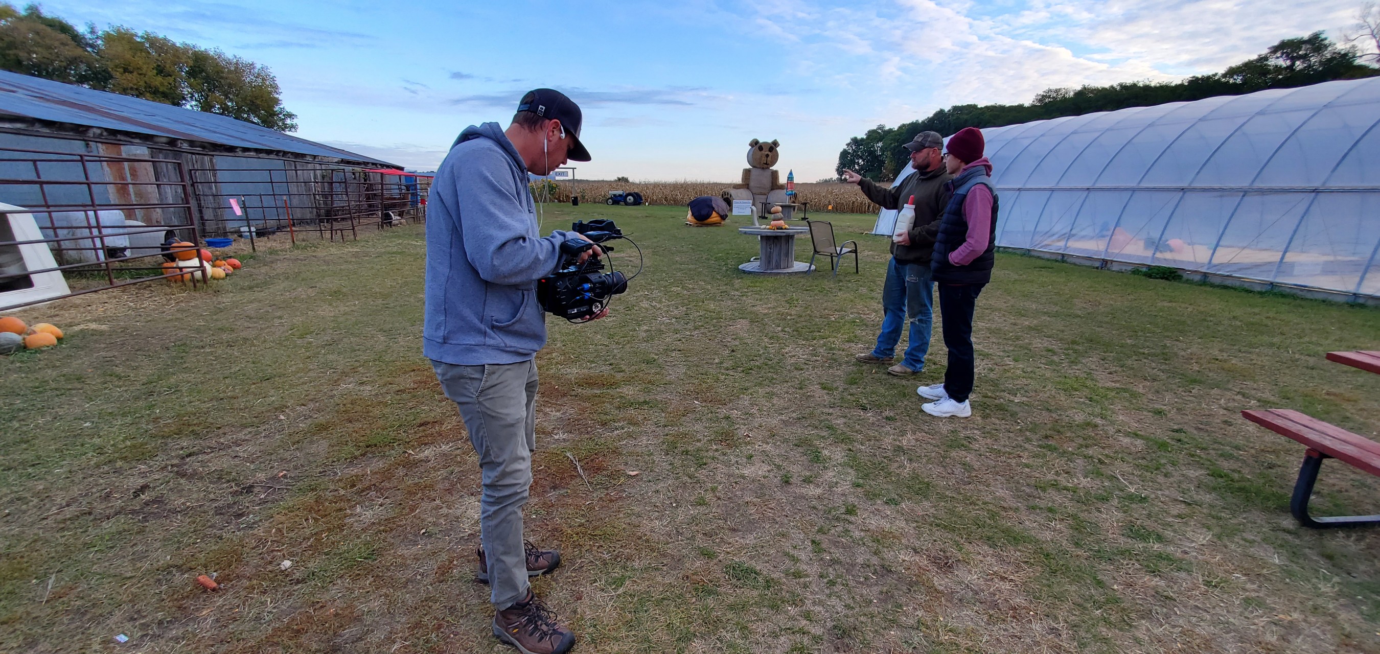 'Rural By Choice' Host Cory Hepola visits with Cordell Huebsch at Otter Berry Farm in Otter Tail County, MN while Micah Kvidt of Kvidt Creative documents their chat.