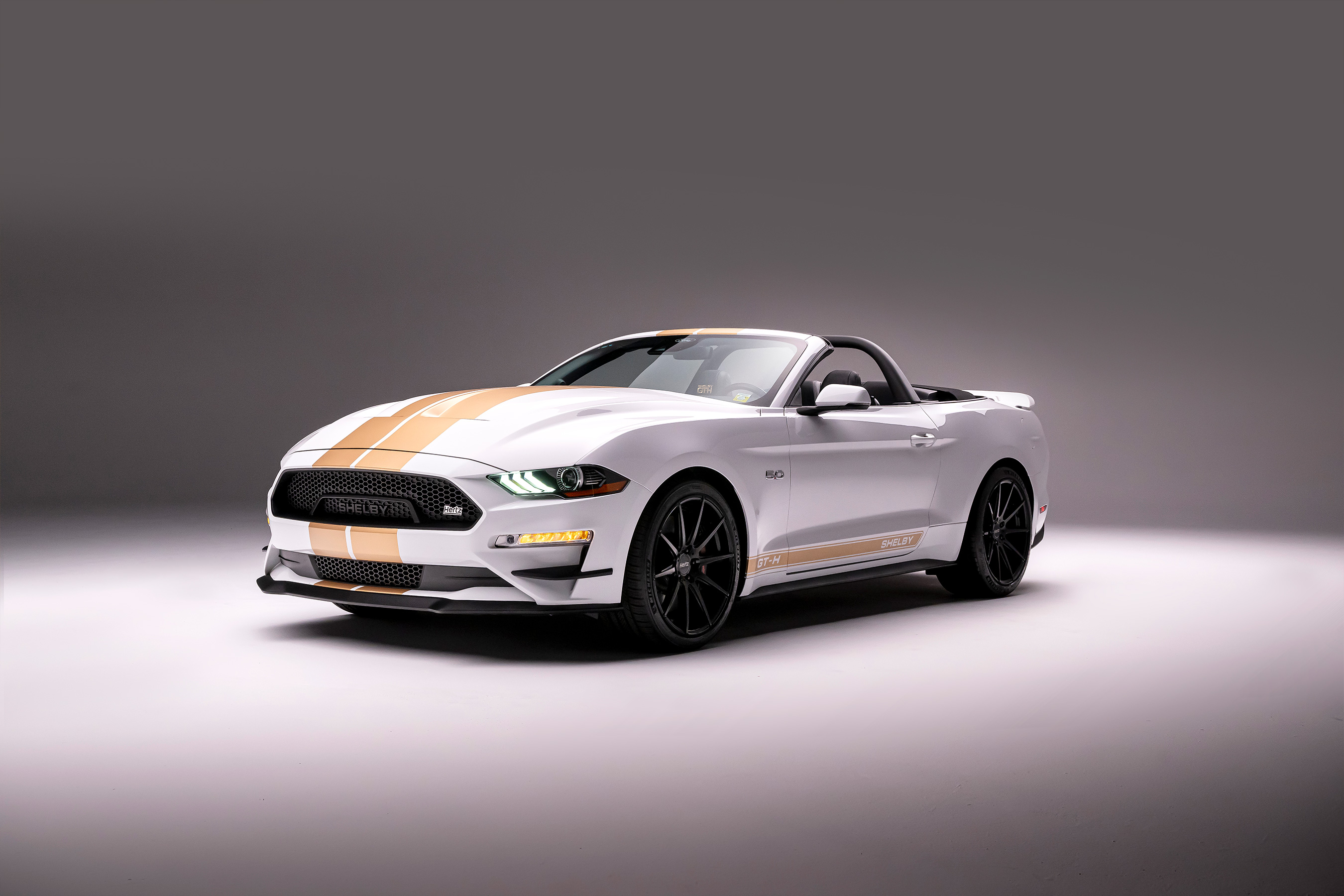 The collection also includes a Mustang Shelby GT-H fastback and convertible, each equipped with a Borla cat-back performance exhaust for the 5.0L V8, and a staggered wheel kit.