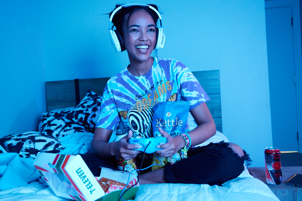 Girl on bed in room with snacks