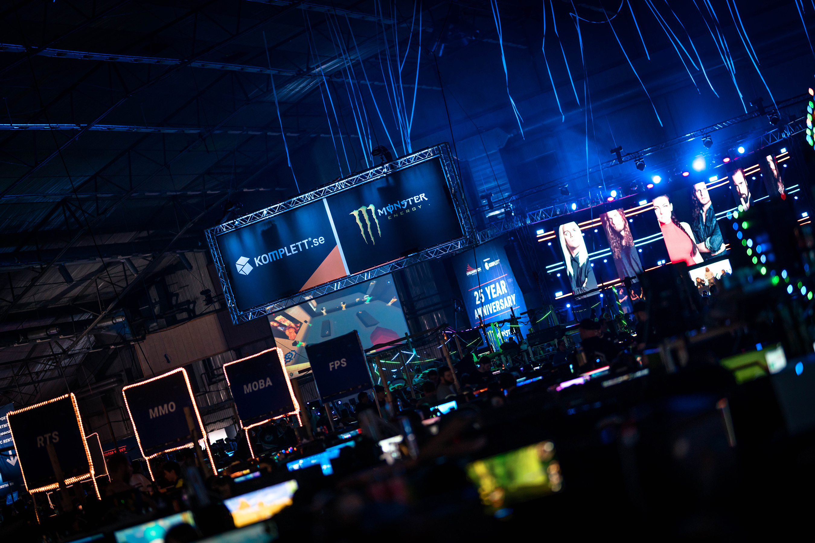 Monster Energy branding is featured above the LAN rows at a DreamHack festival where thousands of gamers play all weekend long.