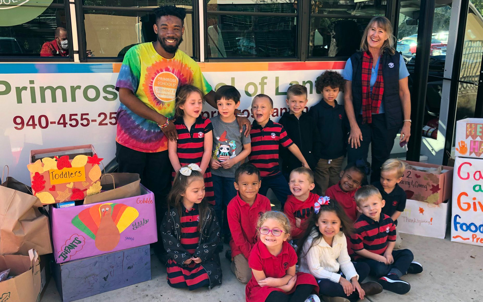 A class at Primrose School of Lantana (Lantana, TX) prepares to deliver canned goods as part of the Caring and Giving Food drive.