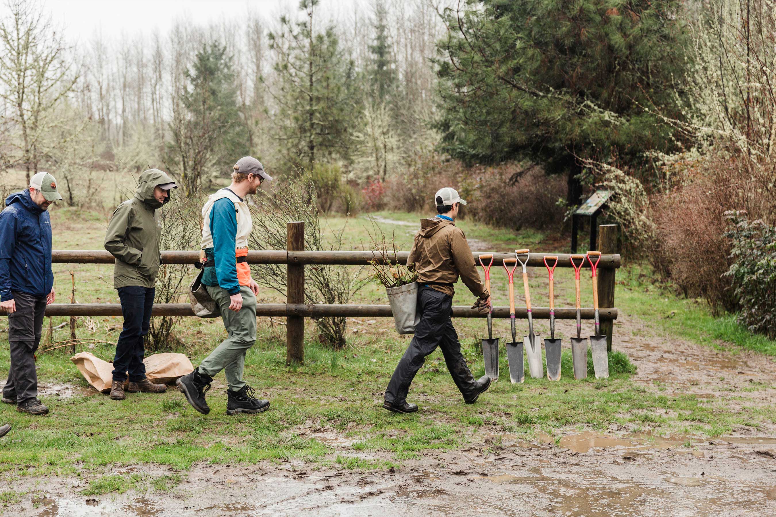 A team prepares to plant tree seedlings in the Pacific Northwest. Clayton and the Arbor Day Foundation will plant trees in four locations like this across the country.