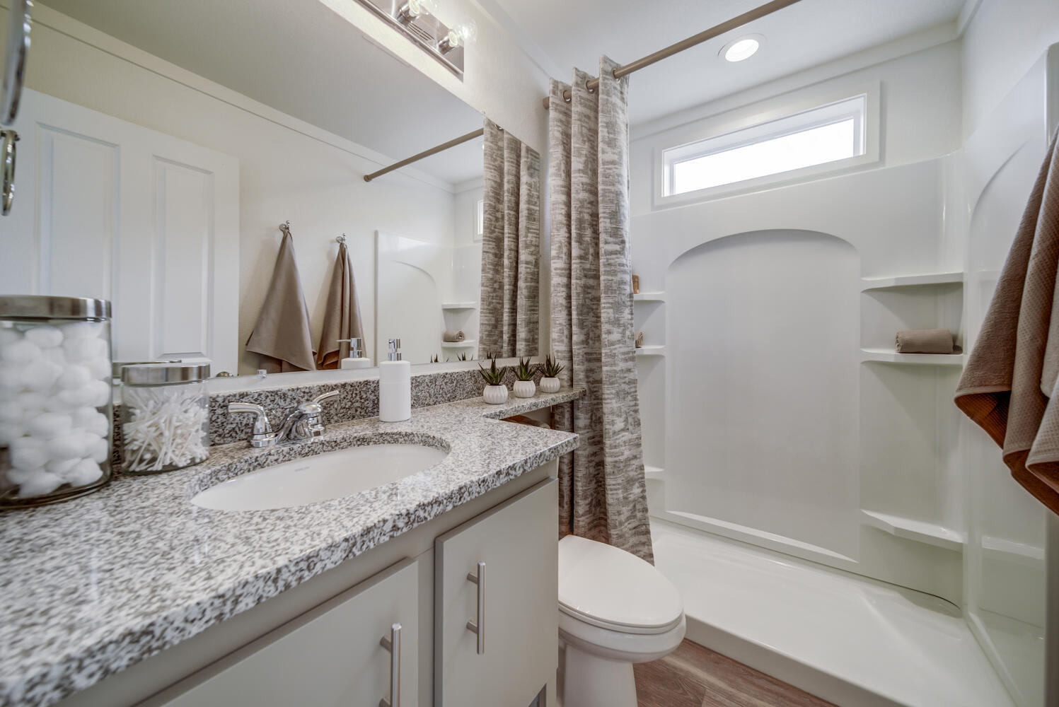 Spacious On2 bathrooms feature natural lighting, stone surfaces and beautiful fixtures.