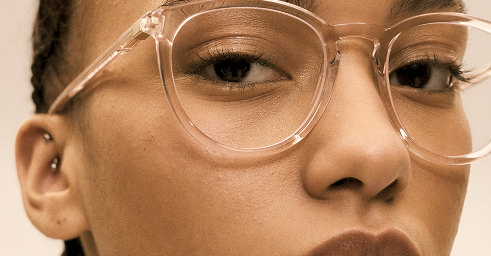 Close up of young woman's glasses