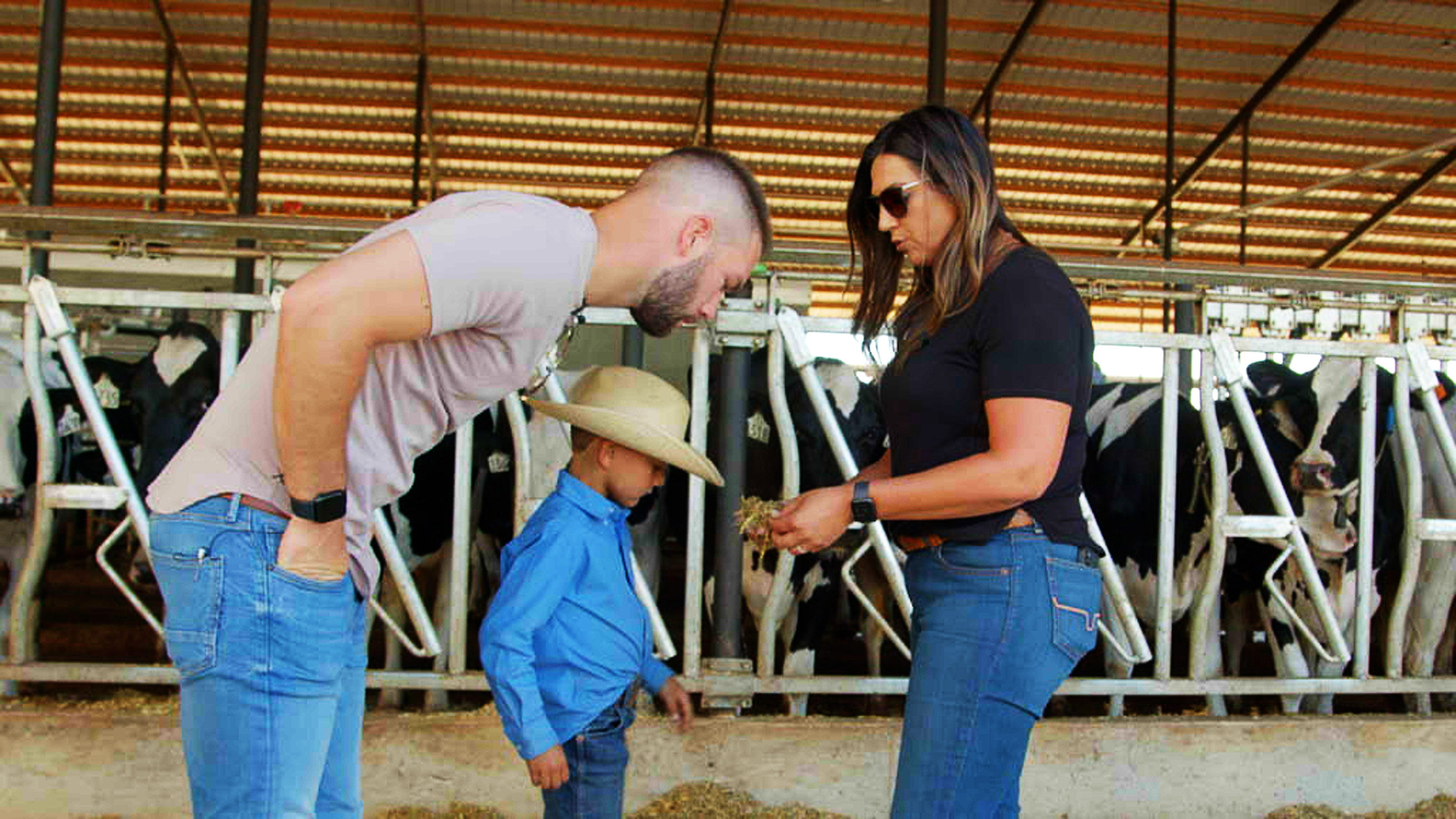 Megan Silva explains the careful formulation of a dairy cow's diet to Jordan Mazur at R&S Dairy in Escalon, CA.