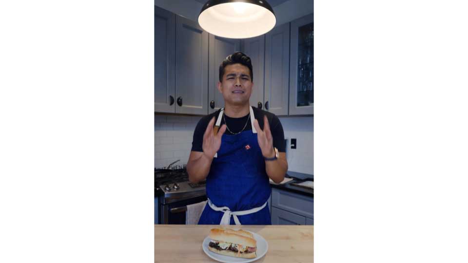 Chef Jordan Andino prepares tri tip sandwich