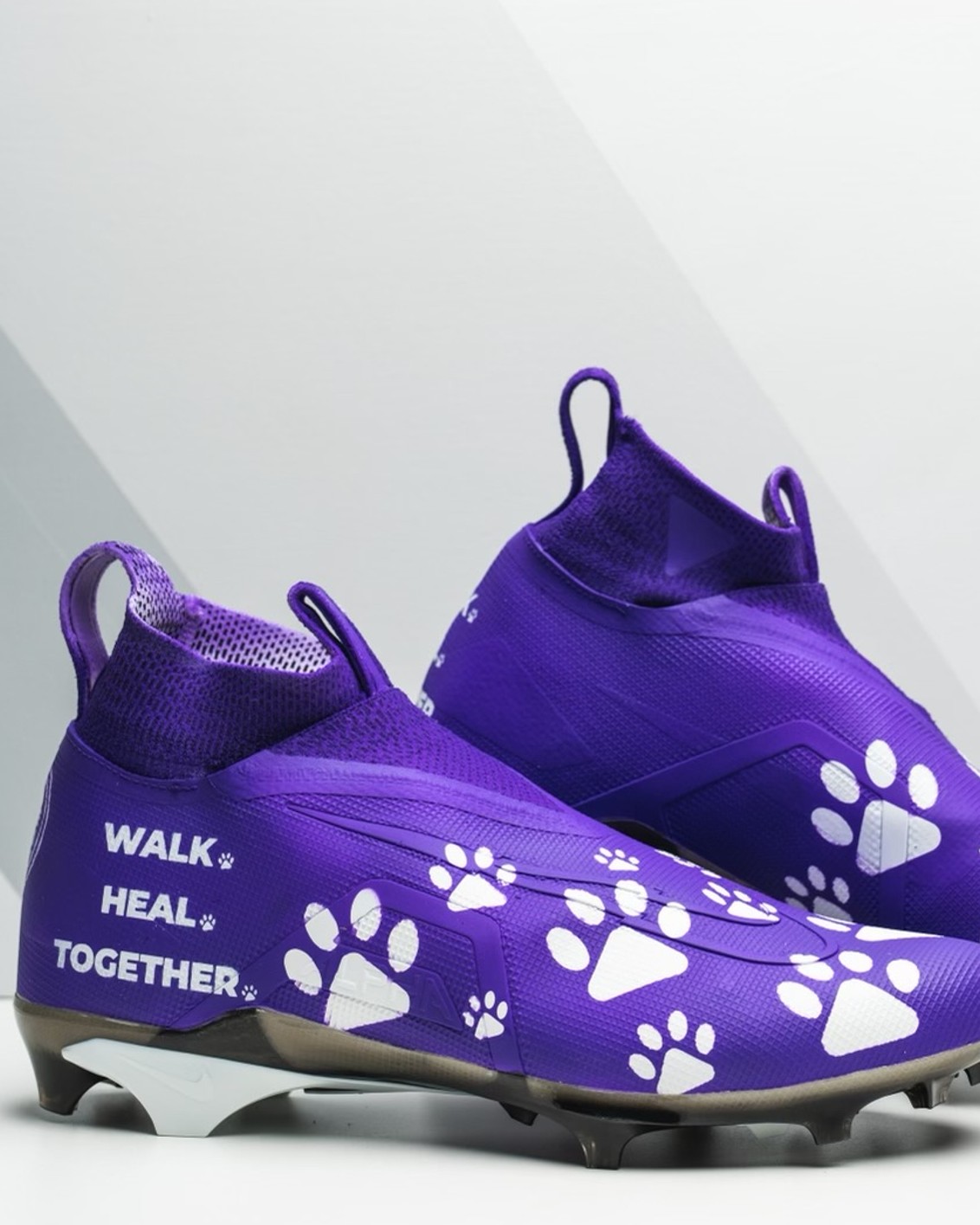 James Smith-Williams custom-designed cleats highlighting the Purple Leash Project