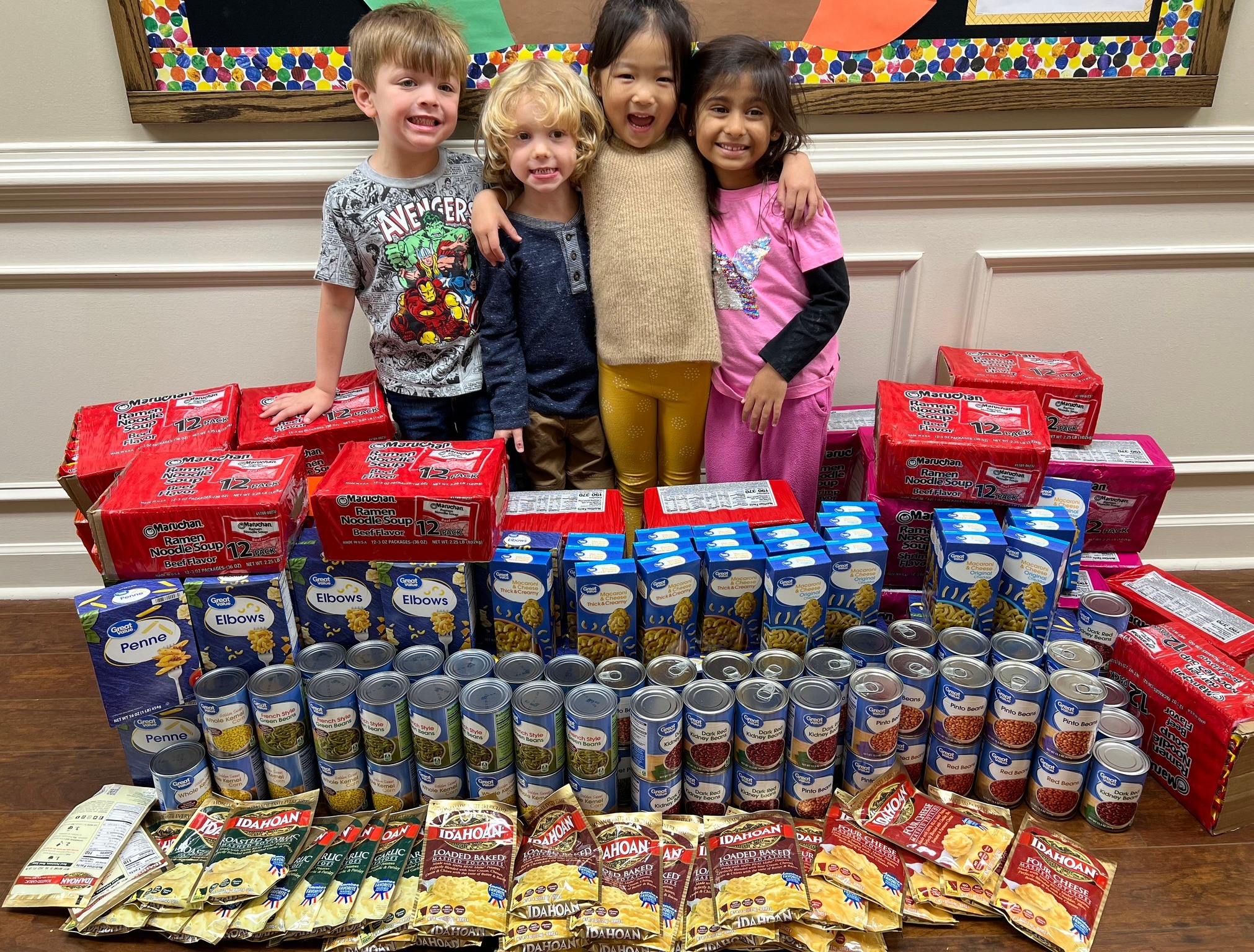 Students from Primrose School at Johns Creek (Suwanee, GA) sort items for the school's annual Caring and Giving Food Drive.