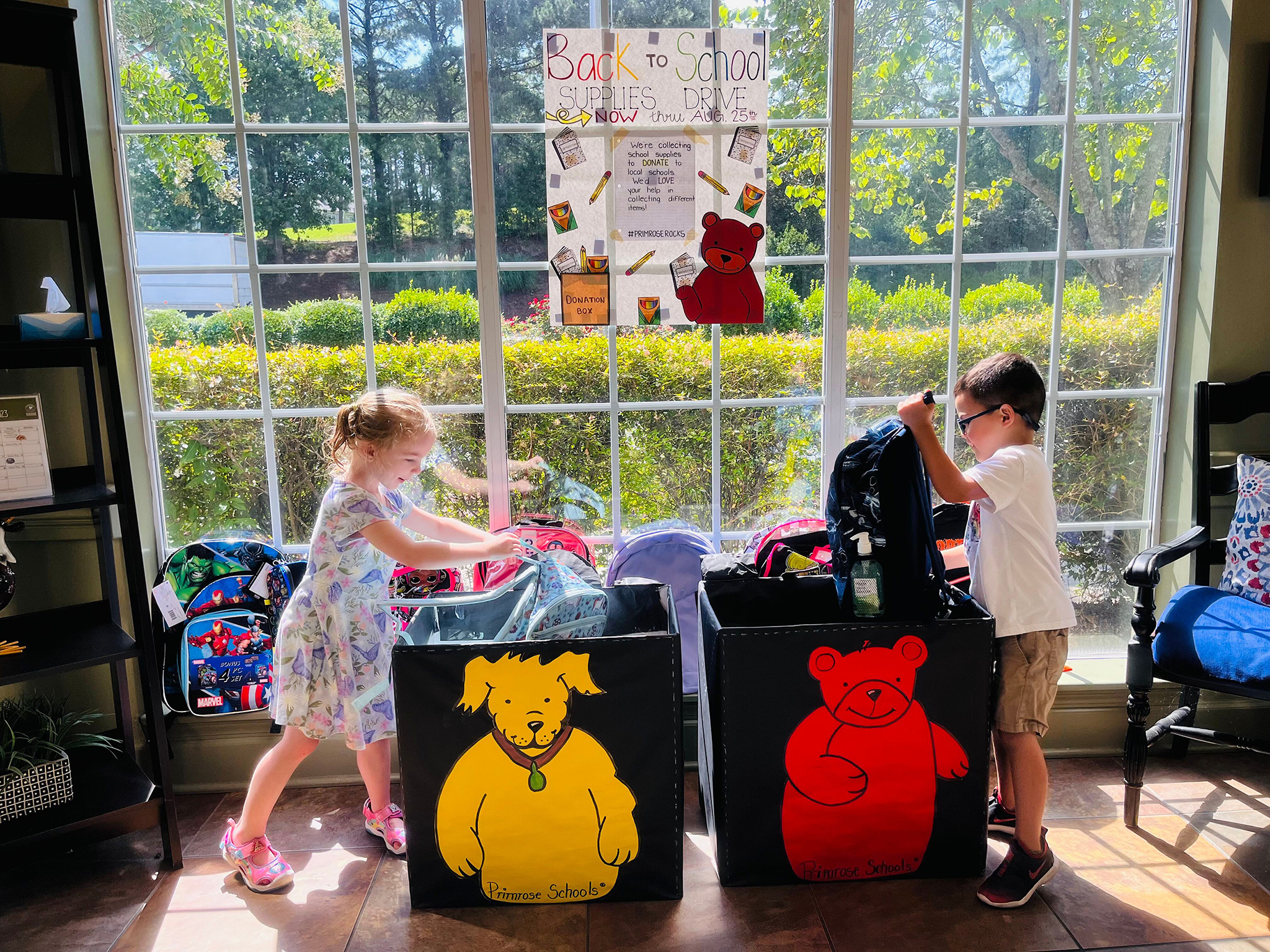 Students at Primrose School at Heritage Wake Forest (Wake Forest, NC) sort school supplies to give to underserved children in their community. 