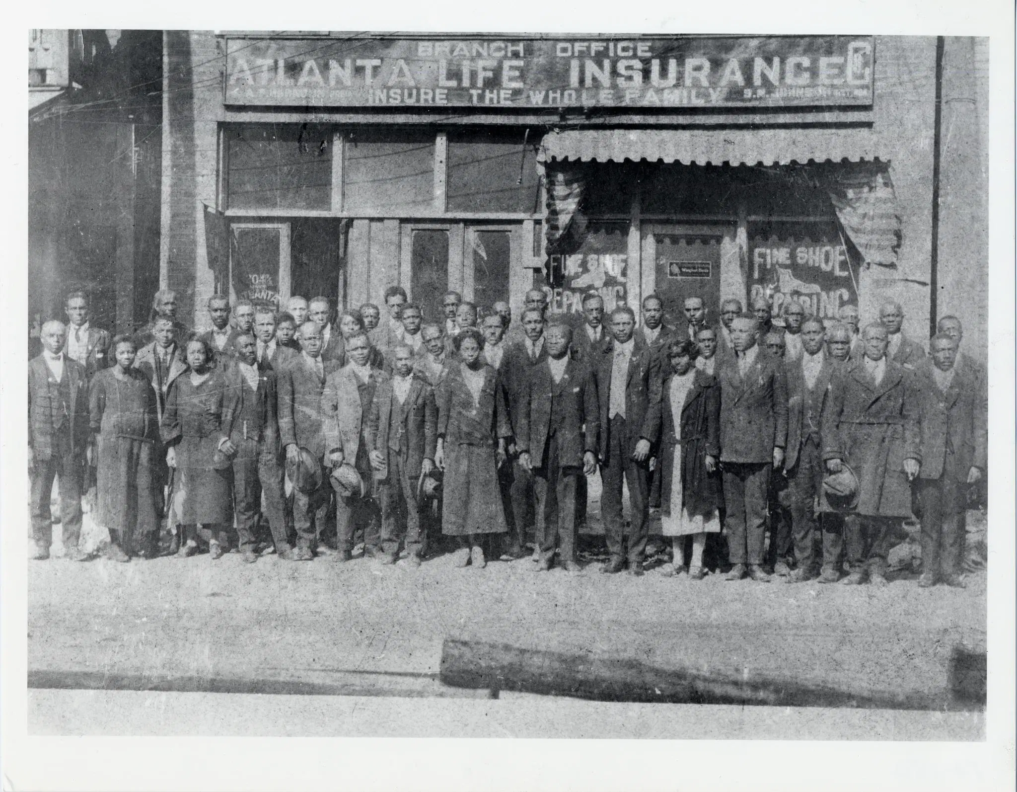 A historical image in front of the original Atlanta Life Insurance Company branch office in Atlanta. The company was founded by Alonzo Herndon more than 100 years ago and is still investing in the community and providing insurance to help policyholders build wealth and create legacies for their families.