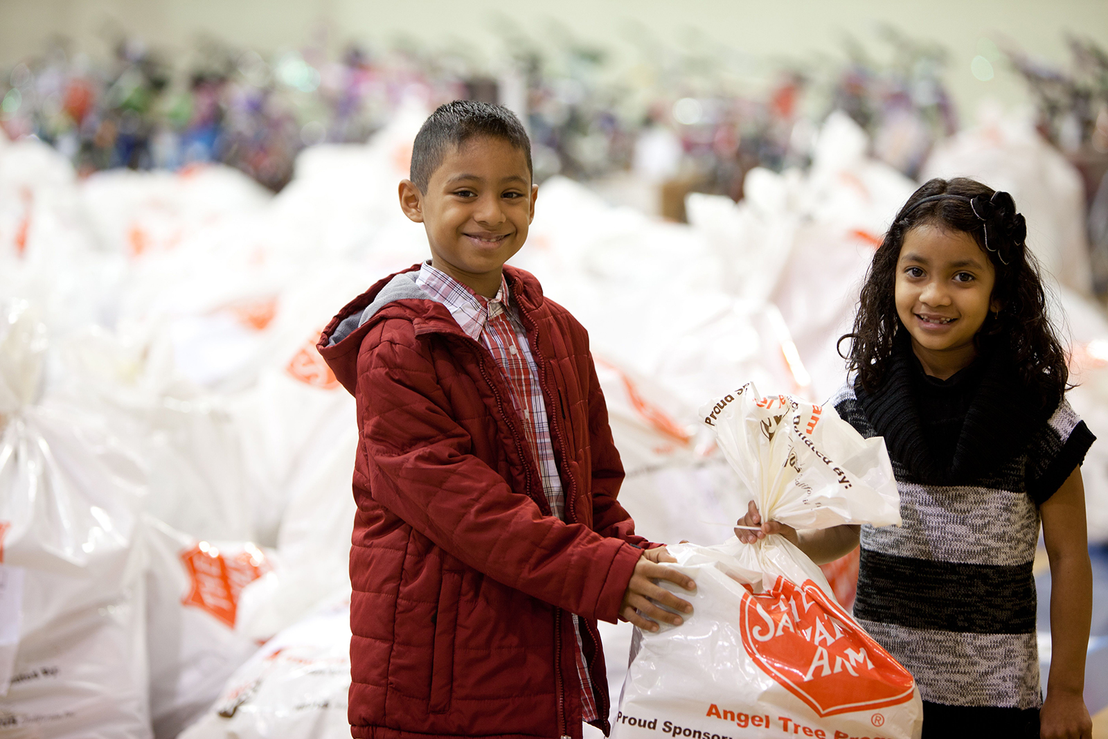 Children receiving Salvation Army Angel Tree Program gifts