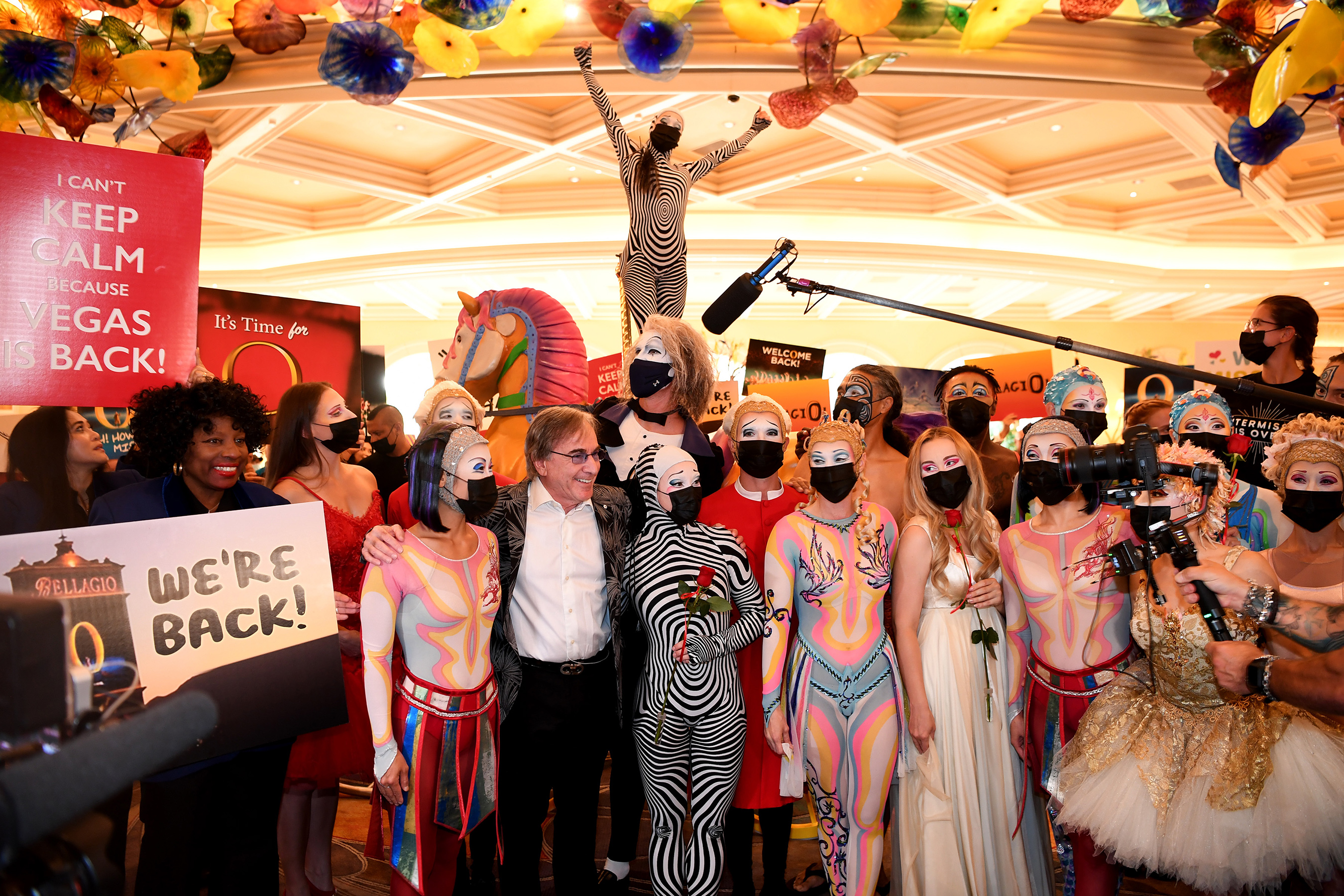 “O” by Cirque du Soleil cast and crew members delight guests at Bellagio as they parade through the resort on reopening night in Las Vegas, July 1, 2021