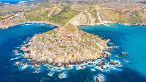 Image of Gnejna Ghajn Tuffieha bay, Malta.  Aerial view of the coastline & scenic cliffs off the Mediterranean turquoise sea.