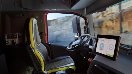 Image of the inside of an autonomous truck - The vehicles are fully autonomous and are managed from the outside by the operator of the wheel loader.