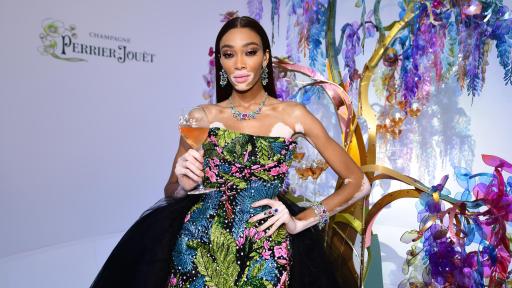 Image of Winnie Harlow in front of the Perrier-Jouët tree designed by Bethan Laura Wood