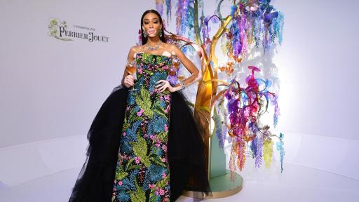 Image of Winnie Harlow in front of the tree designed by Bethan Laura Wood for Perrier-Jouët
