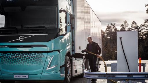 Image of Truck driver charging an electric concept truck.