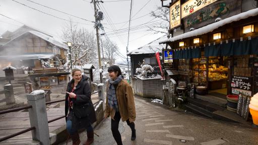 Image of people taking a walk around the cozy mountain village of Nozawa Onsen