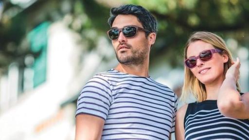 Image of Man and Women modelling sunglasses from the new range from Amorlux made from recycled fishing nets.