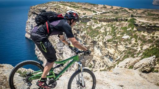 Image of man cycling around the island of Malta