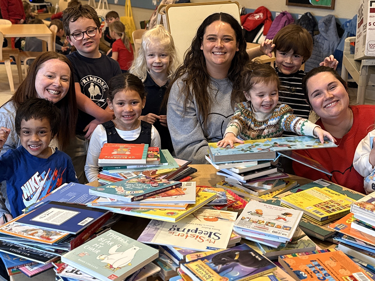 With stacks of books ready to donate, children and teachers from Primrose School of Edina in Minneapolis, Minn., help bring the joy of reading to more families through Og’s Bountiful Book Drive.