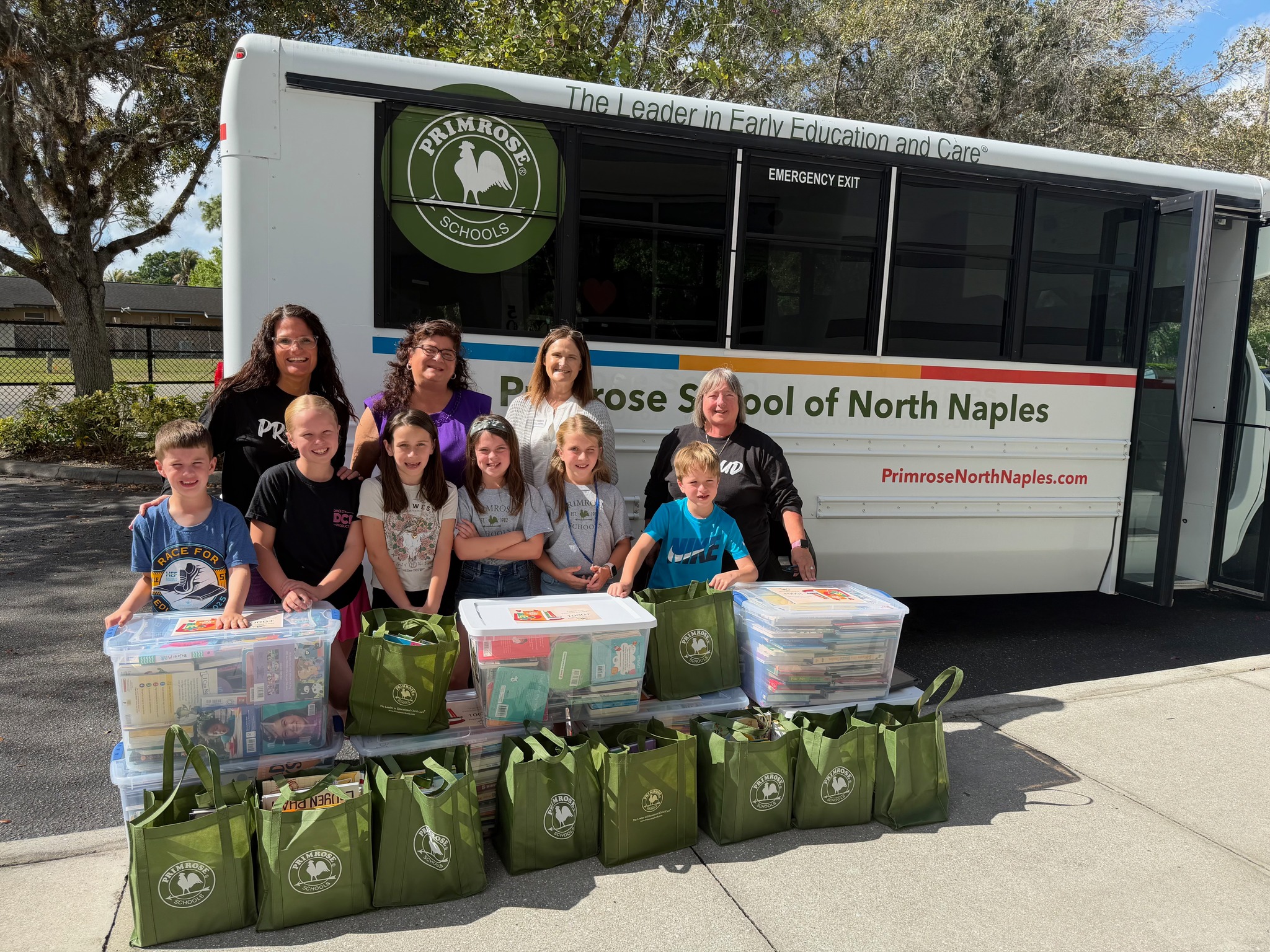 Children and staff at Primrose School of North Naples in Naples, Fla., deliver 1,000 donated books to benefit underserved families in the community.
