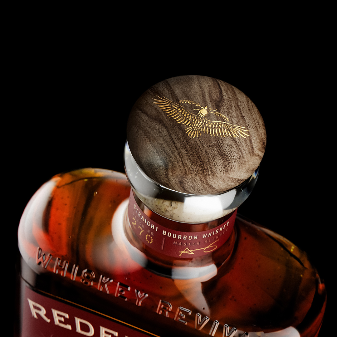 Redemption Whiskey's new bottle design features an embossed eagle motif & wood stopper